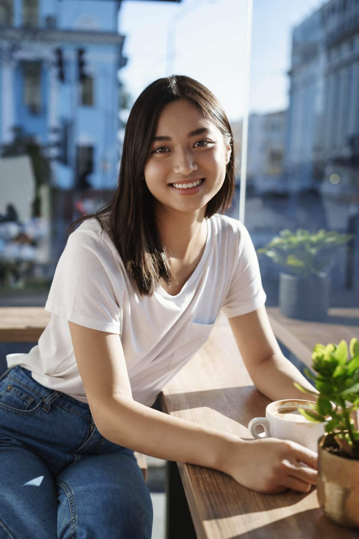 youth-leisure-urban-lifestyle-concept-smiling-cute-lovely-asian-girl-with-short-dark-haircut-sit-casually-cafe-near-windows-streets-town-drink-coffee-having-conversation